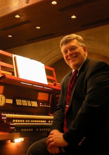 Buzard Organs' founder, John-Paul Buzard, seated at his Opus 7 at The Chapel of St. John the Divine Champaign, Illinois